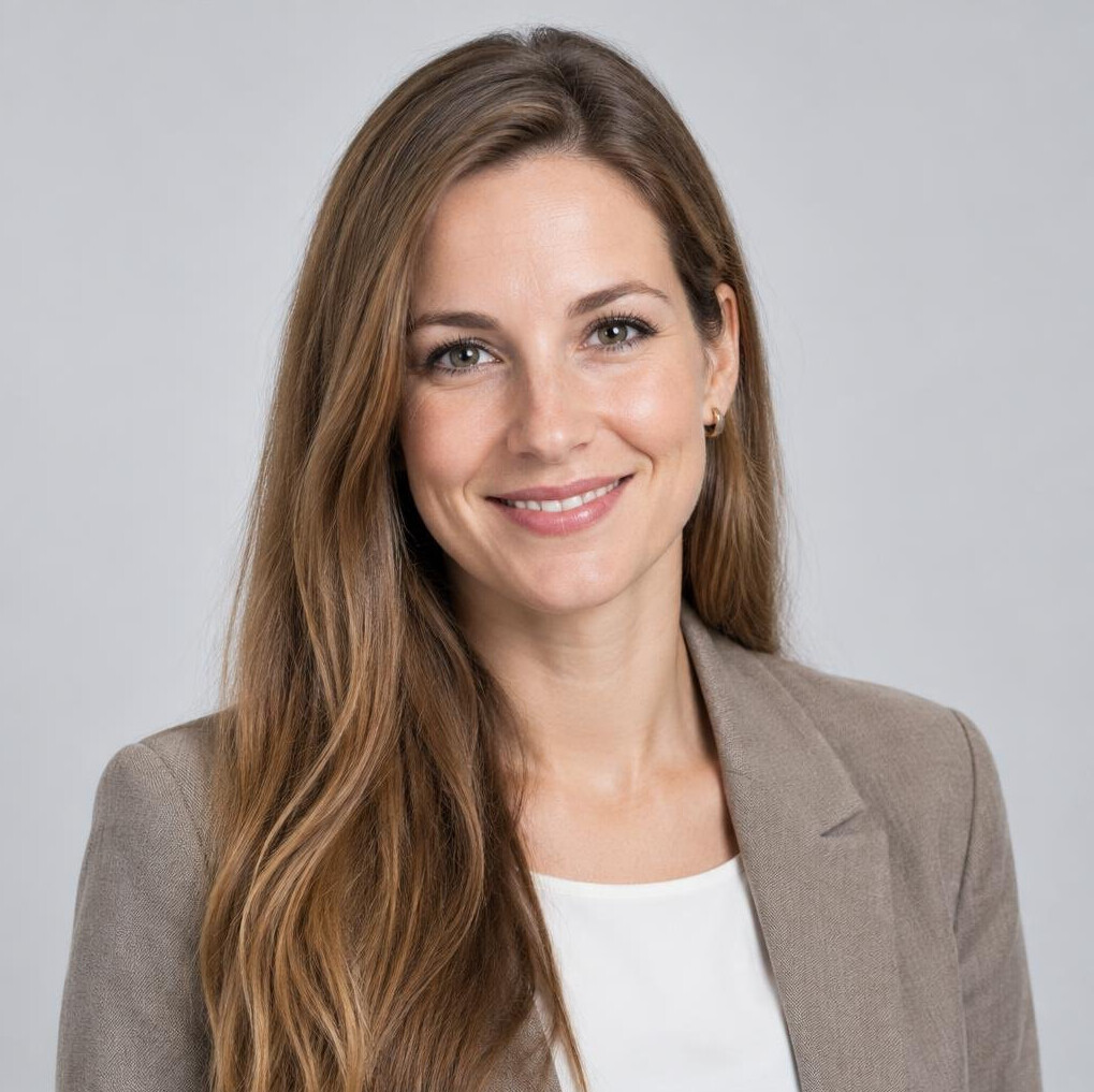 Studio portrait of a Slovenian woman in her 30s with long hair smiling